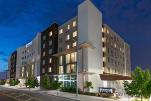 a building on a city street at night at Staybridge Suites - Miami International Airport by IHG in Miami