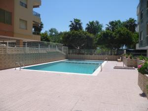 a swimming pool in the middle of a brick patio at MARIVENT-A, 10-30 in Cullera