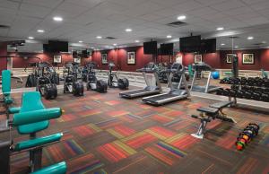 a gym with a lot of treadmills and machines at Holiday Inn Express Nashville-Downtown Conference Center, an IHG Hotel in Nashville