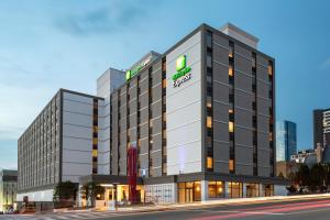 a rendering of the hotel front of the building at Holiday Inn Express Nashville-Downtown - Broadway, an IHG Hotel in Nashville