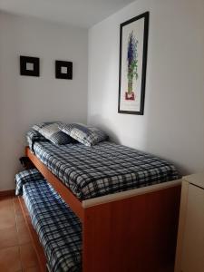 Postel nebo postele na pokoji v ubytování Atico Con Vistas En Zahara Pueblo