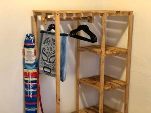 a wooden book shelf with a snowboard on a wall at Refugio del Cielo # in Sayulita