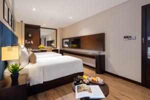 Uma cama ou camas num quarto em Minh Toan SAFI Ocean Hotel