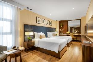 Uma cama ou camas num quarto em Minh Toan SAFI Ocean Hotel
