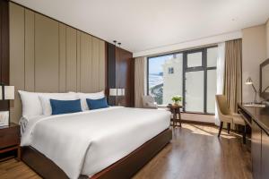 Uma cama ou camas num quarto em Minh Toan SAFI Ocean Hotel