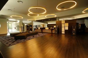 a large living room with a bed and wooden floors at Penafiel Park Hotel & Spa in Penafiel +42 photos