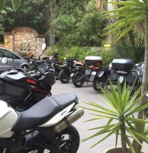 motorcycles parked next to each other at Grand Hôtel De Calvi in Calvi