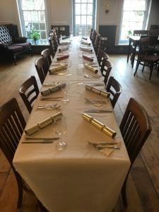 a long table with wine glasses and napkins on it at The Dorset in Lewes