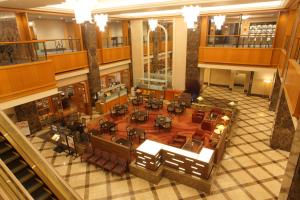 an overhead view of a library with tables and chairs at Hotel Metropolitan Nagano in Nagano