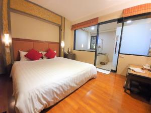 Postel nebo postele na pokoji v ubytování Chyuan Du Spring Resort