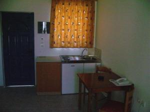 A cozinha ou cozinha compacta de Stegna Star Apartments