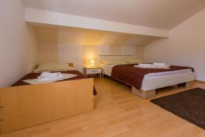 Posteľ alebo postele v izbe v ubytovaní Apartment LINDA