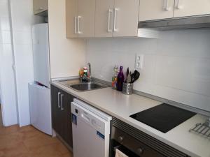 a kitchen with a sink and a counter top at La Marina Solo Familias!!! Serviplaya in Playa de Xeraco