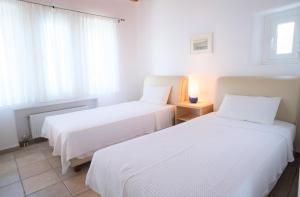 Cama ou camas em um quarto em Aeri Villas & Apartments