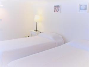 Cama ou camas em um quarto em Aeri Villas & Apartments