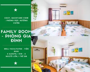 een kamer in een huis met 2 bedden en een groene banner bij Dreamy Sky - Airport View Boutique Hotel in Da Nang