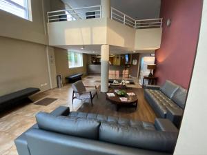 an overhead view of a living room with a blue couch at Lummina Barueri Alphaville in Barueri