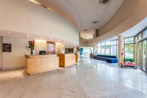 a lobby of a hospital with a reception desk at Beach Class Convention By Mai in Recife