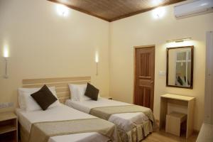 Postel nebo postele na pokoji v ubytování Escapism Maldives