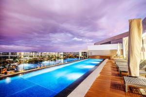 a swimming pool on the roof of a building at Menlyn Maine Residence Unit 1419 in Pretoria