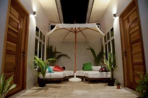 Postel nebo postele na pokoji v ubytování Escapism Maldives