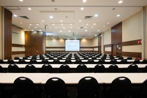an empty conference room with a large table and chairs at Mercure Rio de Janeiro Nova Iguaçu in Nova Iguaçu +75 photos