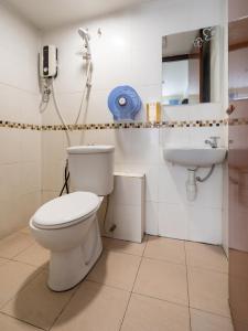 a bathroom with a toilet and a sink at OYO 89717 Budget Star Hotel in Kuala Lumpur