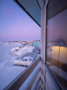 a view of the ocean from a balcony of a building at Hotel Icefiord in Ilulissat