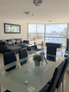 a living room with a table and a couch at Moorings On Cavill Surfers Paradise in Gold Coast