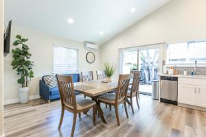 a kitchen and dining room with a table and chairs at @ Marbella Lane 6BR Duplex in Downtown San Jose in San Jose