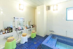 a bathroom with two toilets and a swimming pool at Business Ryokan Akashiya Annex in Akashi +54 photos