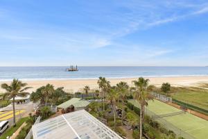 a view of the beach from the balcony of a resort at 19th Avenue on the Beach in Gold Coast