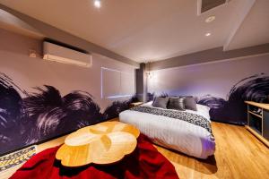 Tempat tidur dalam kamar di Hotel Lotus Koiwa (Adult Only)