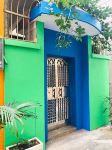 a colorful front door of a building at March Garden next to the Furniture Market in Shunde