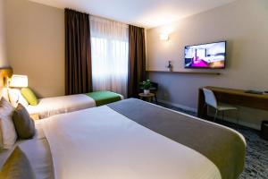 Katil atau katil-katil dalam bilik di Utopia Hotel - Art & Nature Hotel