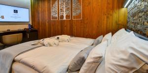 Posteľ alebo postele v izbe v ubytovaní WILLIAM Congress&Wellness Mountain HOTEL ****