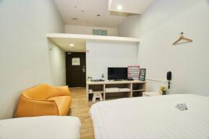 TV a/nebo společenská místnost v ubytování Place‧X Hotel