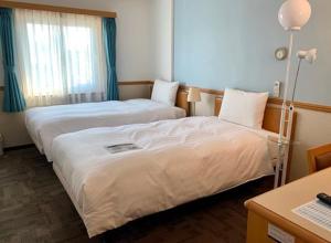 Ліжко або ліжка в номері Toyoko Inn Seoul Dongdaemun I