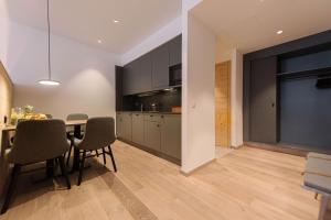 a kitchen and dining room with a table and chairs at Hotel Johanns in Hilpoltstein