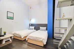 Postel nebo postele na pokoji v ubytování Place‧X Hotel