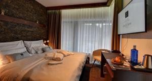 Posteľ alebo postele v izbe v ubytovaní WILLIAM Congress&Wellness Mountain HOTEL ****