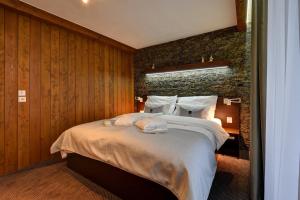 Posteľ alebo postele v izbe v ubytovaní WILLIAM Congress&Wellness Mountain HOTEL ****