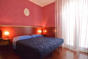 Postel nebo postele na pokoji v ubytování Hotel Galassi