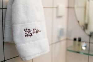 a towel on a towel rack in a bathroom at Gastronomy Hotel Kritsa in Portaria