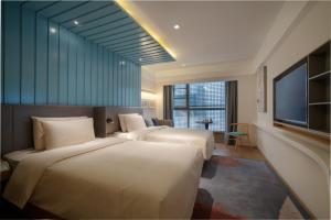 Postel nebo postele na pokoji v ubytování CityNote Hotel Beijing Road Pedestrian Guangzhou