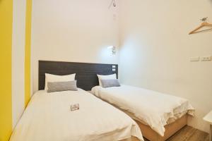 Postel nebo postele na pokoji v ubytování Place‧X Hotel