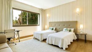 Cama ou camas em um quarto em Villa Marina