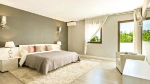 Cama ou camas em um quarto em Villa Marina