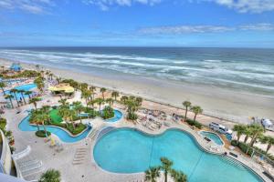 an overhead view of the pool and beach at a resort at Wyndhams Ocean Walk Resort in Daytona Beach