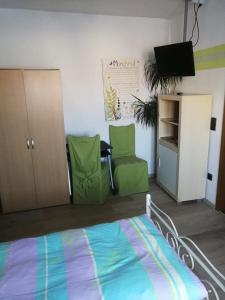 Postel nebo postele na pokoji v ubytování Pension Harmonie